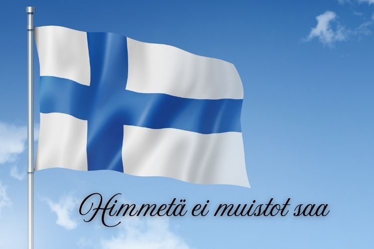 Veteraanipäivän messu Suomen lippu sinitaivasta vasten ja teksti